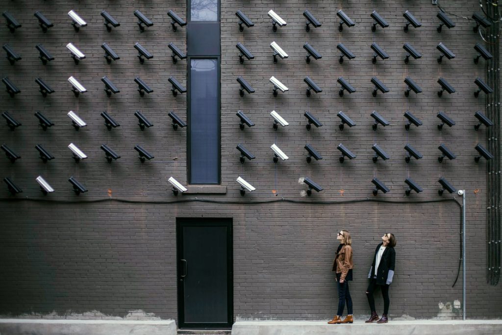 Black and white cameras on building